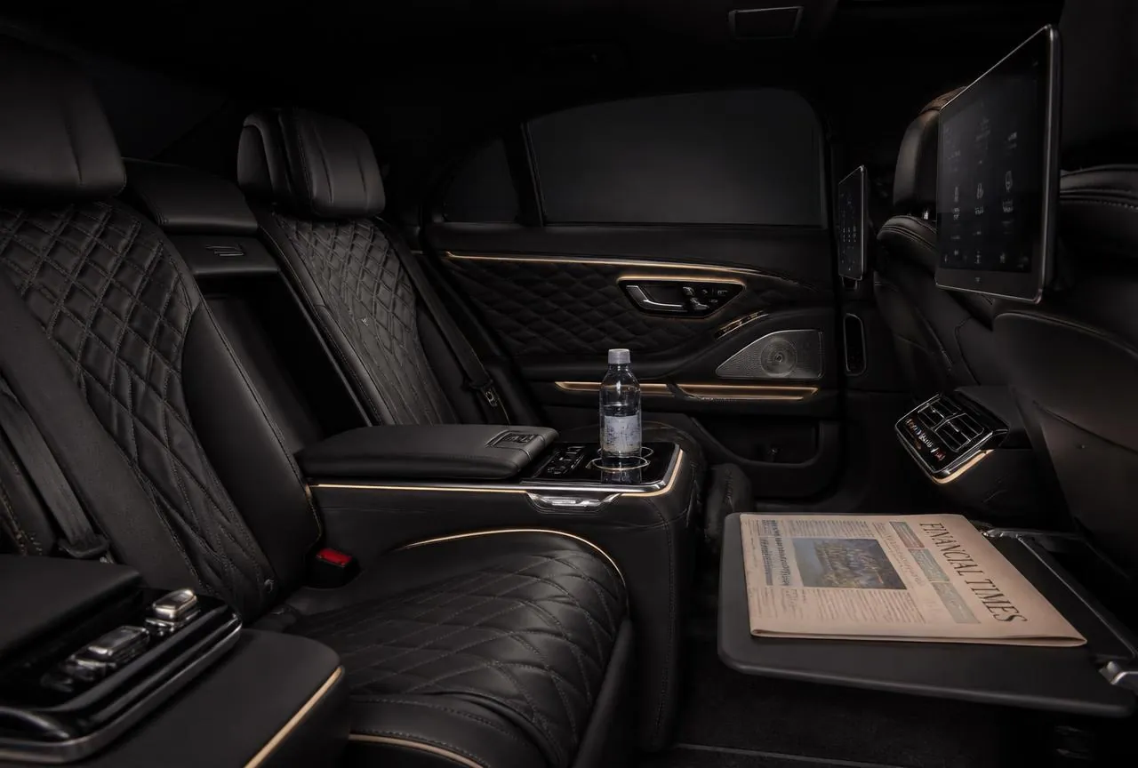 Rear cabin of a Sofia Chauffeur chauffeur limousine with quilted leather seats
